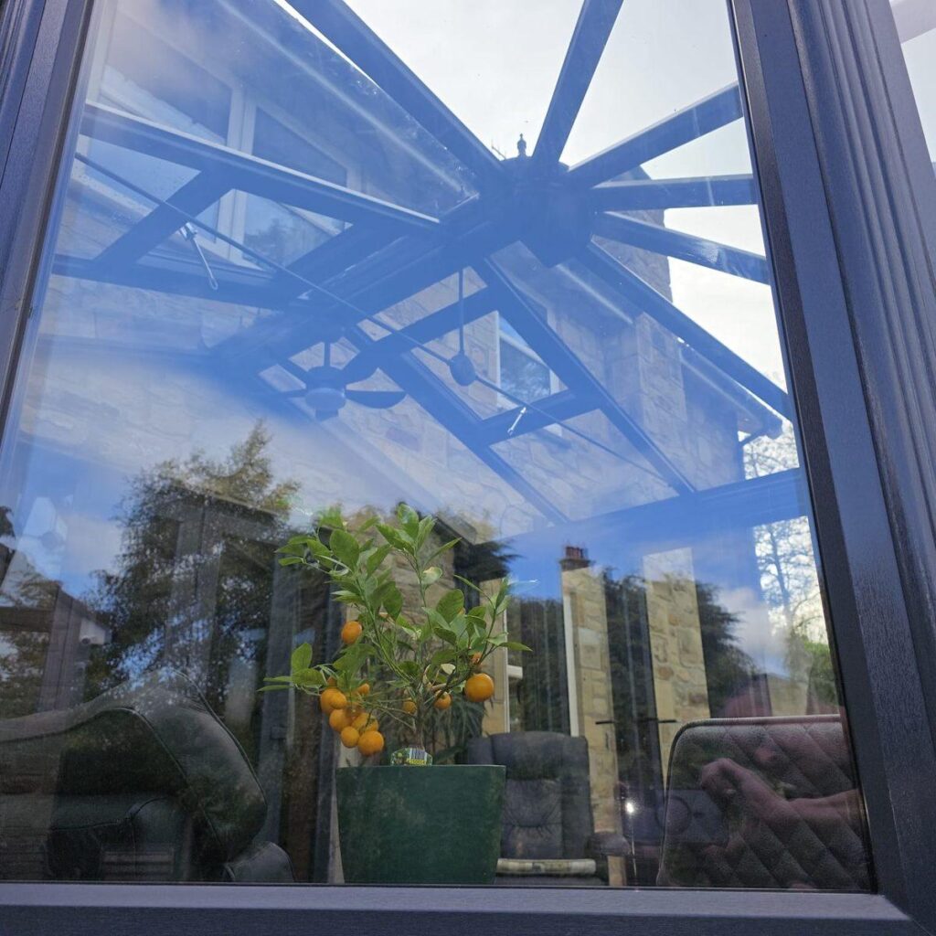 Conservatory with full-height glazing and glass roof panels