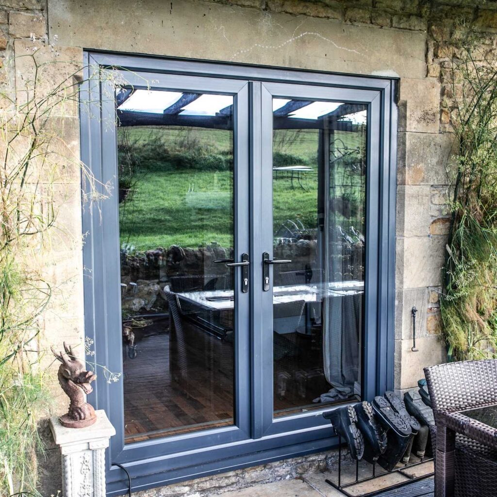 White French doors installed with matching side lights