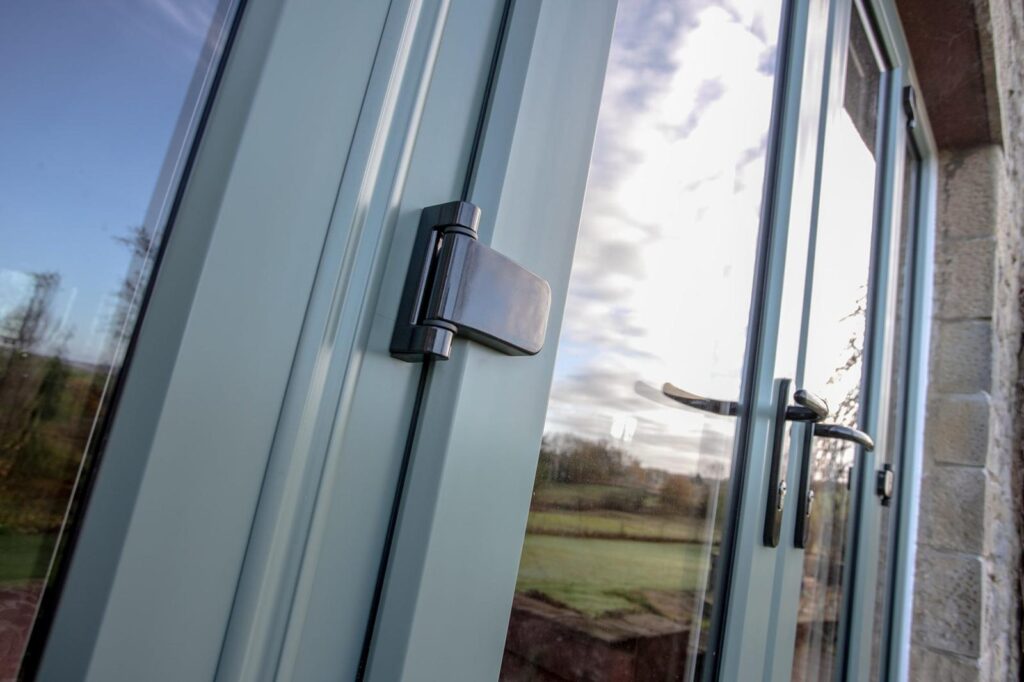 Close-up of premium window handle hardware with multi-point secure locking